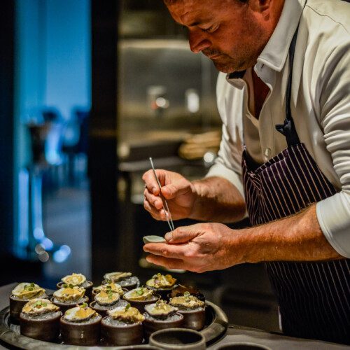 Chef Doug Keane plates oysters